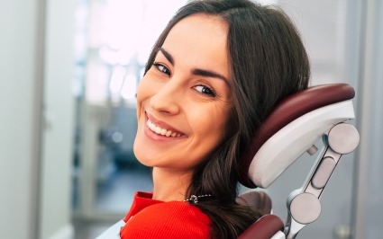 Woman smiling during restorative dentistry appointment