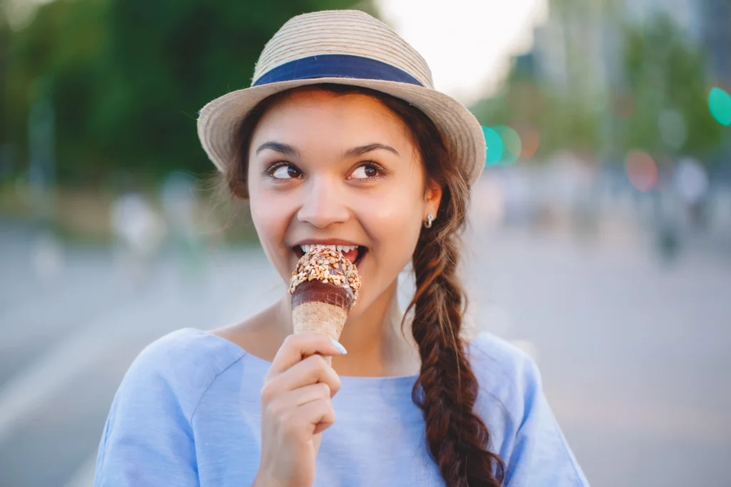 woman happily eating ice cream dentist Short Pump VA
