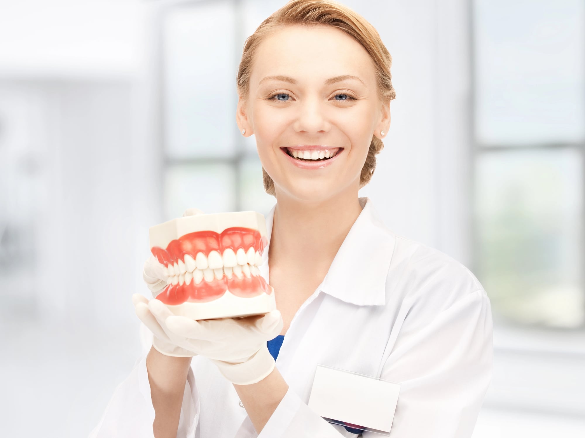 dentist showing a model of a mouth Invisalign in Short Pump VA