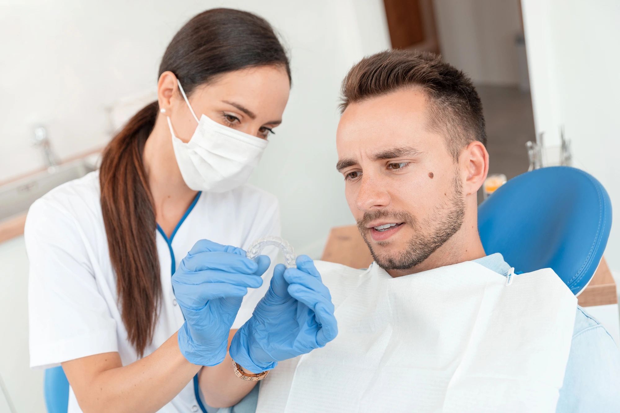 dentist showing patient Invisalign in Richmond, VA