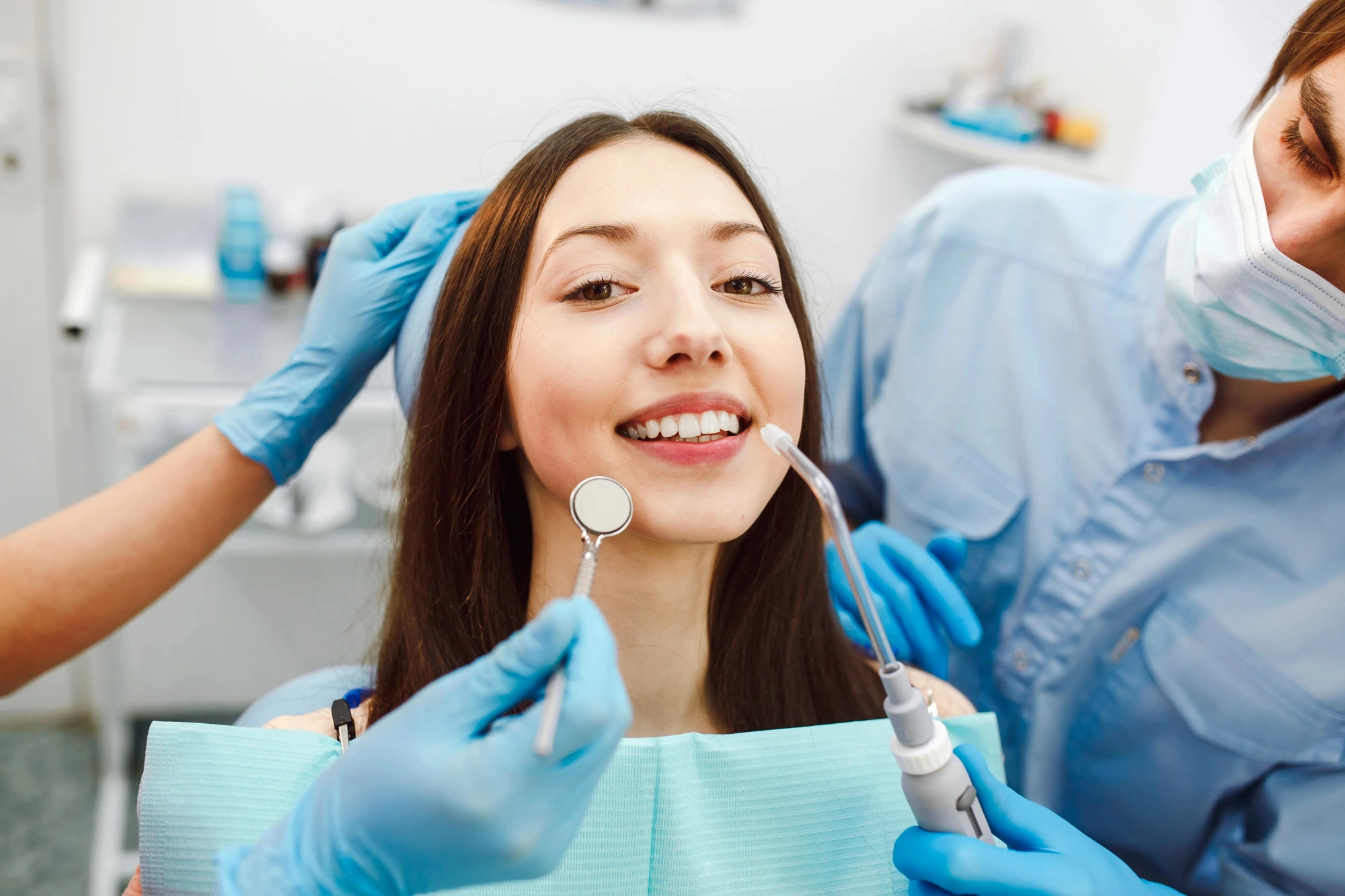 woman-happy-at-the-dentist-after-dealing-with-a-dental-emergency-in-Richmond