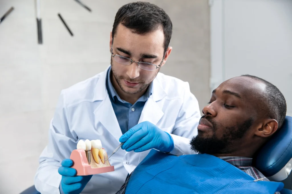 dentist explaining dental implants in Short Pump to patient