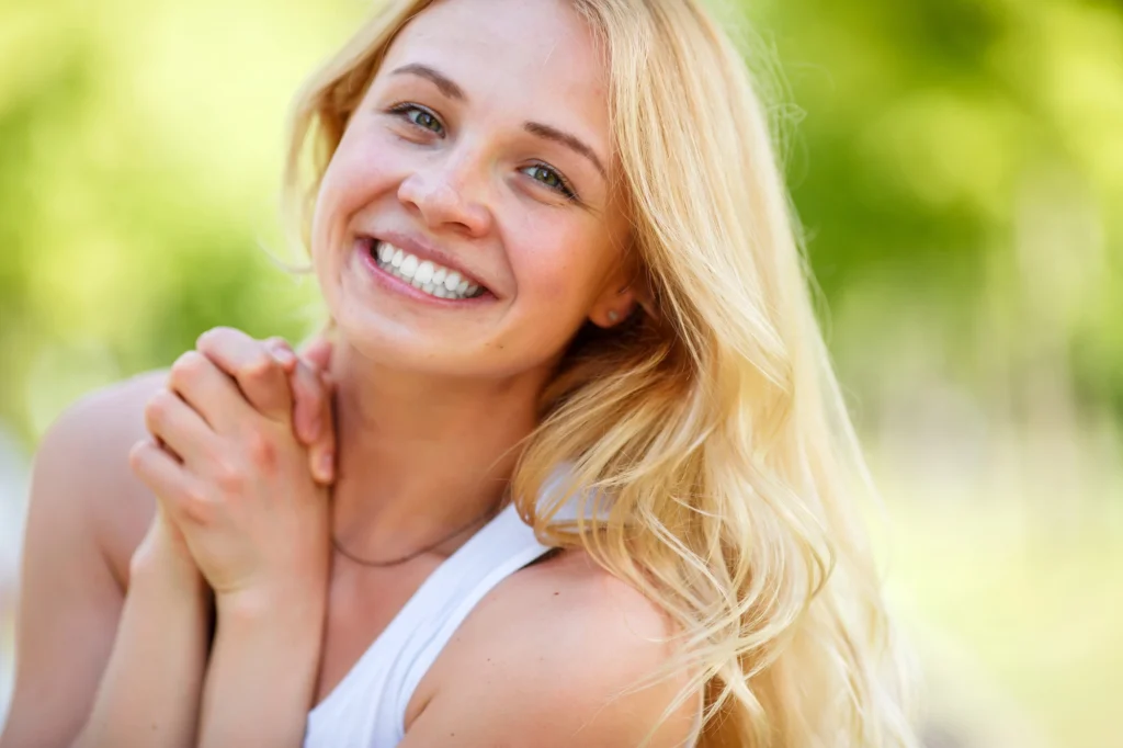 happy woman after a teeth cleaning in Richmond
